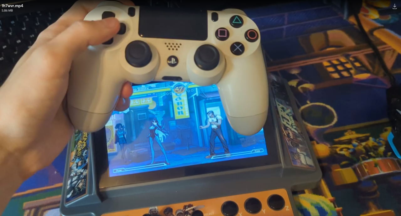 GuileWinQuote showing his Rupture Void versus setup with a PlayStation pad wired to the Laptop Arcade